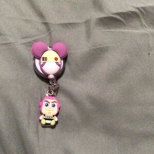 Disney Purple and Yellow lanyard badge holder with  Baby Buzz Lightyear Charm